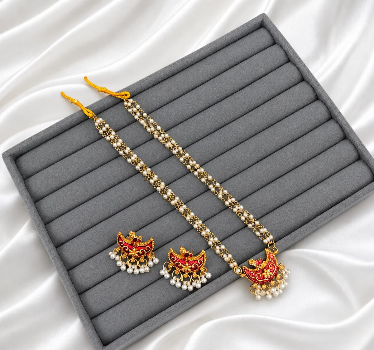 Adorn yourself with a touch of tradition in an exclusive pearl and Meenakari jewellery set!