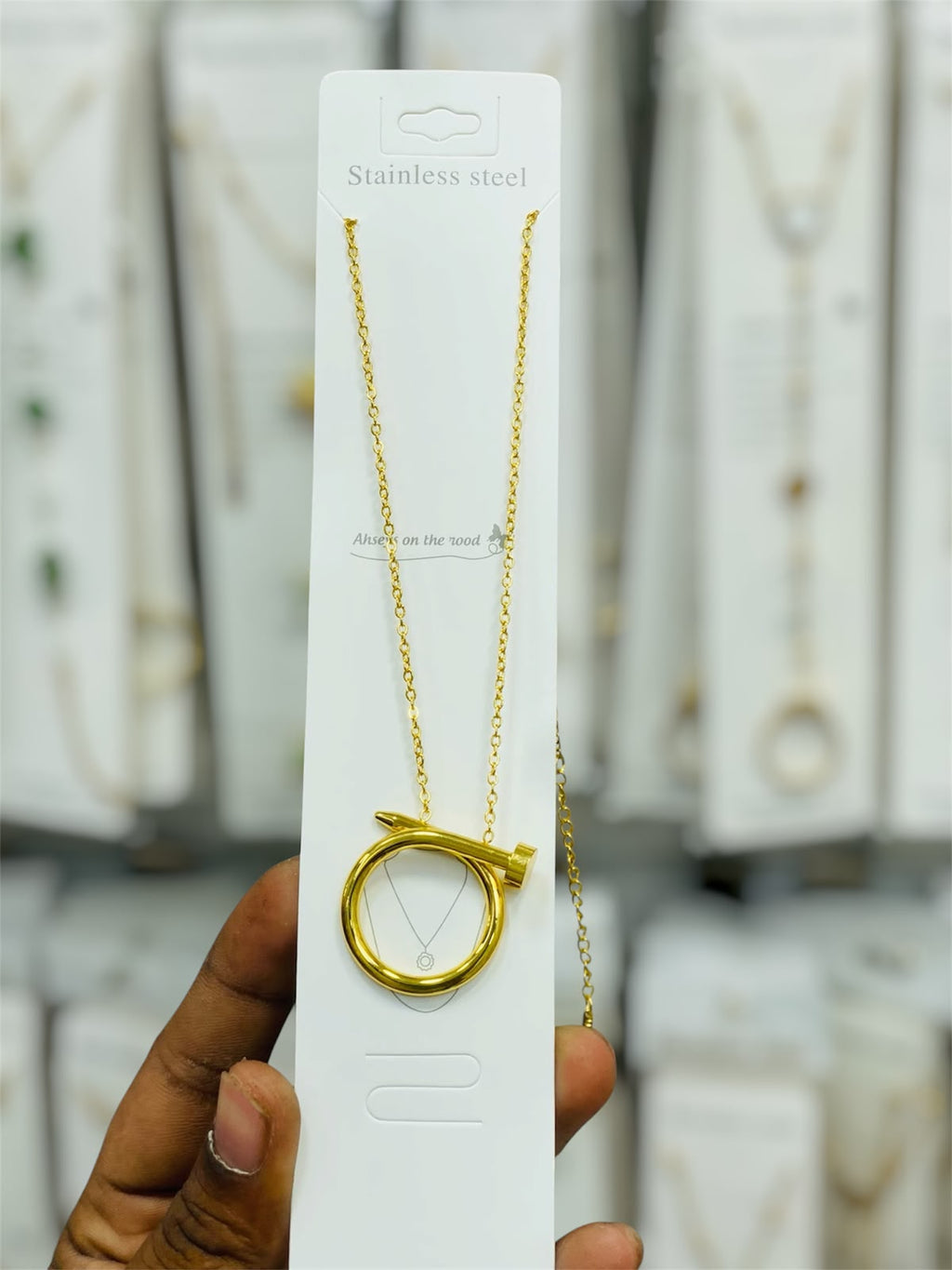 An iconic 'Nail Motif' pendant chain to add a bold and gorgeous style to your outfit!