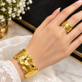 A glossy, golden, crumpled-texture jewellery set to bring out a regal elegance in your look!